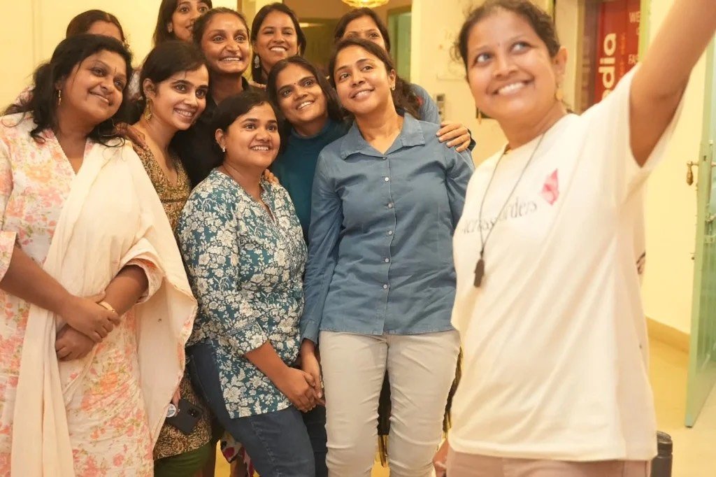 Mothers smiling together after a The Motherhood Company session